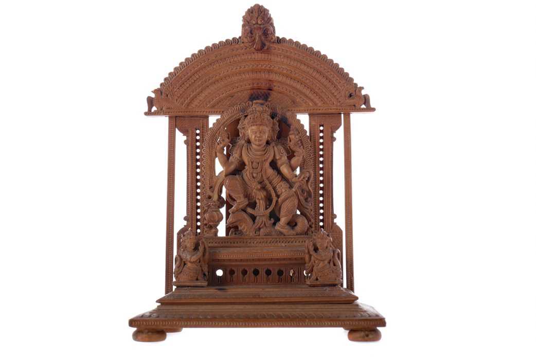Lot 336 - AN EARLY 20TH CENTURY INDIAN CARVED SANDALWOOD FIGURE OF A DEITY