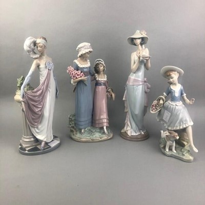Lot 250 - A LLADRO FIGURE OF A FEMALE HOLDING A CUP AND SAUCER AND THREE OTHERS