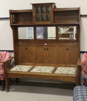 Lot 1174 - ARTS & CRAFTS OAK HIGH BACK SETTLE IN THE...