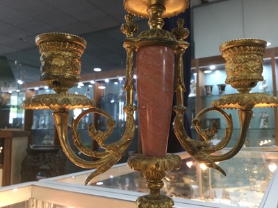 Lot 372 - A PAIR OF LATE 19TH CENTURY ORMOLU AND ROUGE MARBLE CANDELABRA