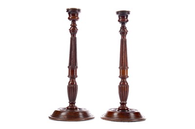 Lot 57 - A PAIR OF GEORGE III STYLE MAHOGANY CANDLESTICKS