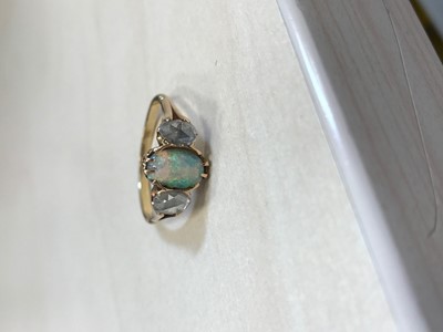 Lot 561 - AN OPAL AND DIAMOND RING