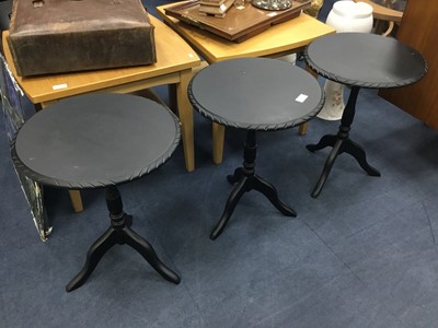 Lot 482 - A LOT OF THREE EBONISED CIRCULAR OCCASIONAL TABLES