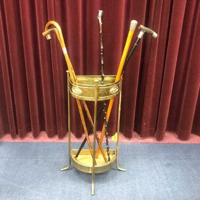 Lot 2 - A BRASS SEMI CIRCULAR STICK STAND AND VARIOUS STICKS AND CANES