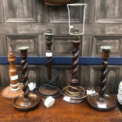 Lot 456 - A PAIR OF MAHOGANY TURNED WOOD CANDLESTICKS AND THREE TABLE LAMPS