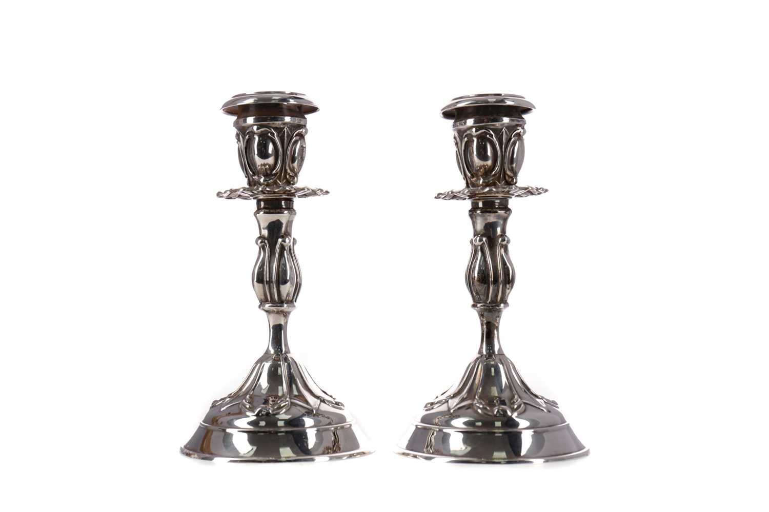 Lot 448 - A PAIR OF CONTINENTAL ARTS & CRAFTS SILVER CANDLESTICKS