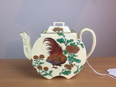 Lot 69 - A WEDGWOOD AESTHETIC MOVEMENT EARTHENWARE TEAPOT AND COVER