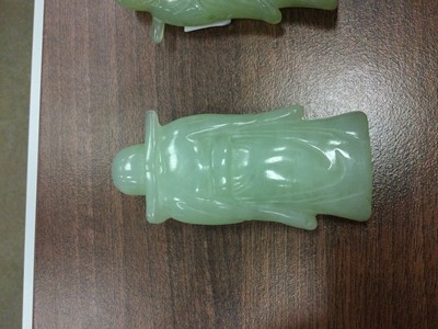 Lot 724 - A LOT OF TWO 20TH CENTURY CHINESE GREEN HARDSTONE FIGURES AND TWO PIGS