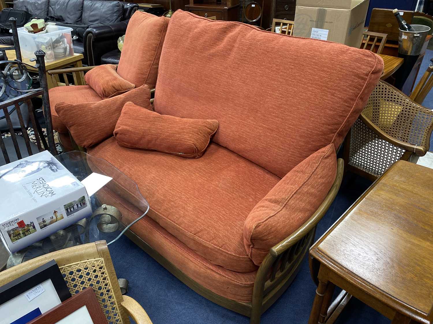 Lot 58 - AN ERCOL SETTEE AND MATCHING ARMCHAIR