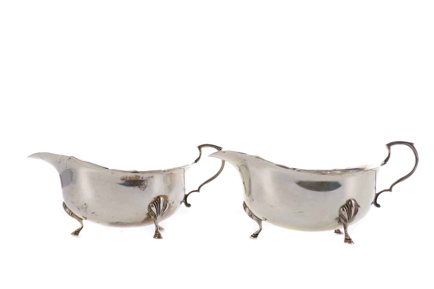 Lot 434 - A PAIR OF ELIZABETH II SILVER SAUCEBOATS
