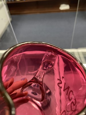 Lot 1159 - A LATE VICTORIAN CRANBERRY GLASS WATER JUG