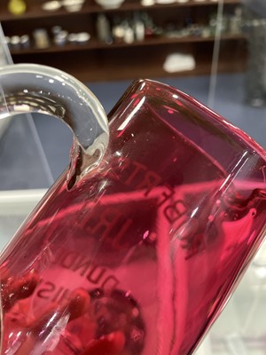 Lot 1159 - A LATE VICTORIAN CRANBERRY GLASS WATER JUG