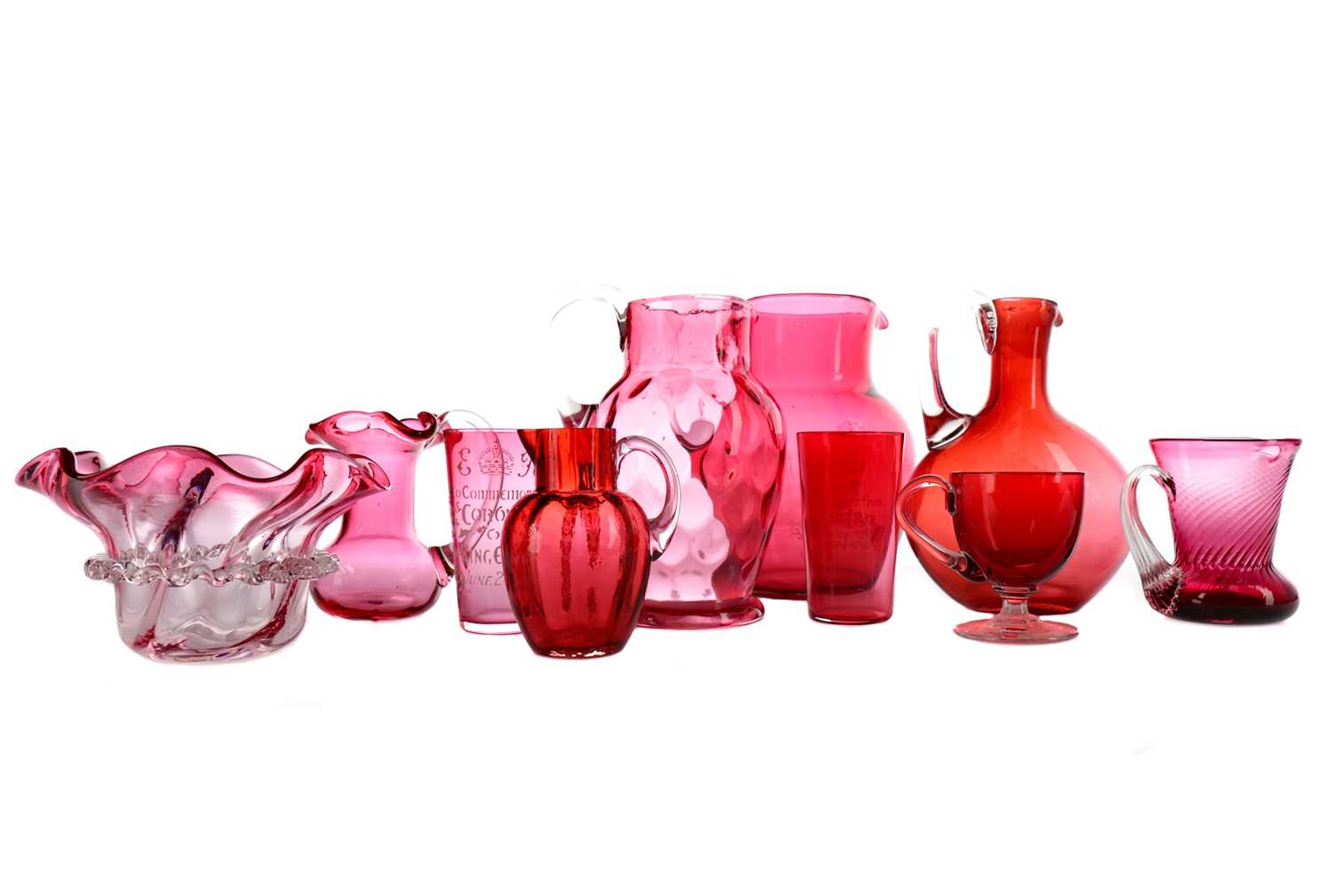 Lot 1160 - AN EDWARDIAN CRANBERRY GLASS SOUVENIR JUG