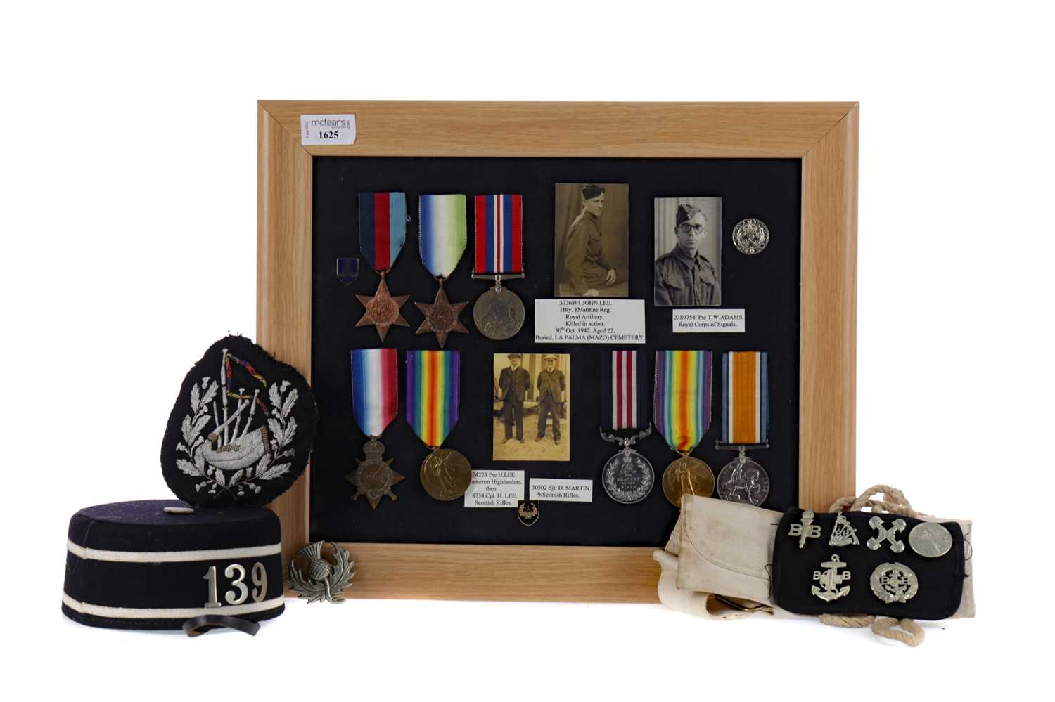 Lot 1625 - A FRAMED GROUP OF WWI & WWII SERVICE MEDALS