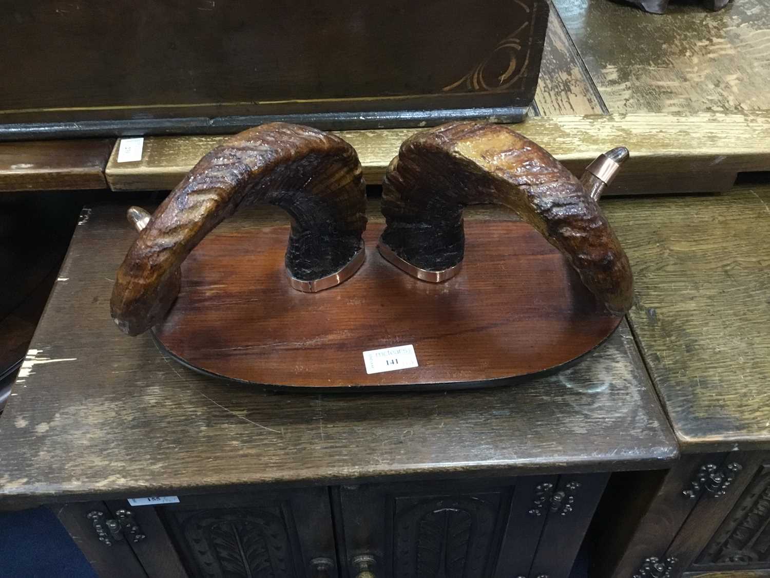 Lot 141 - A MOUNTED PAIR OF BRASS BOUND RAM'S HORNS AND OTHER ITEMS