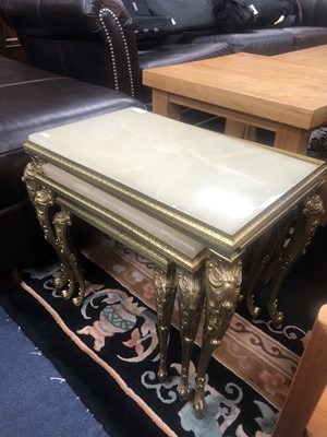 Lot 154 - AN ONYX AND BRASS NEST OF THREE TABLES AND A FIRESCREEN