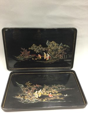 Lot 889 - A SET OF FIVE CHINESE LACQUERED RECTANGULAR TRAYS AND A MOTHER OF PEARL INLAID TRAY