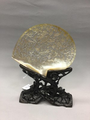 Lot 857 - A CHINESE ABALONE SHELL ON WOOD STAND