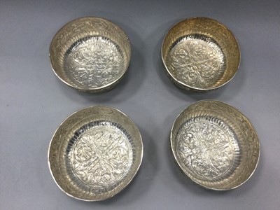Lot 892 - A SET OF FOUR 20TH CENTURY EASTERN SILVER CIRCULAR BOWLS, A STEMMED CUP AND A CIGARETTE CASE