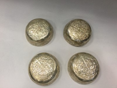Lot 892 - A SET OF FOUR 20TH CENTURY EASTERN SILVER CIRCULAR BOWLS, A STEMMED CUP AND A CIGARETTE CASE