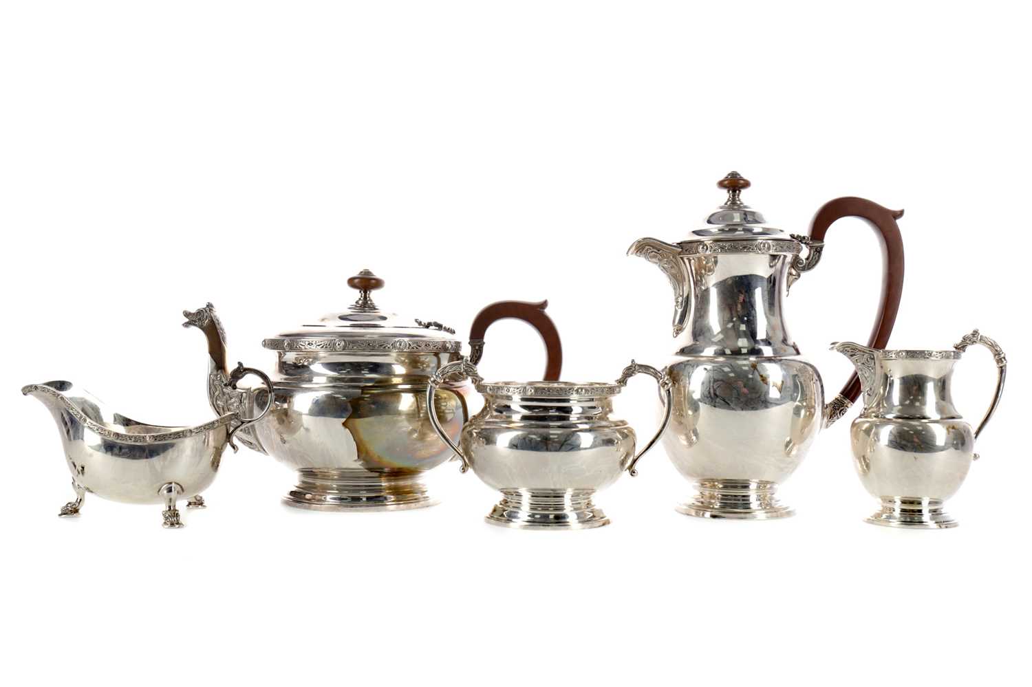 Lot 471 - A GEORGE VI SILVER FOUR-PIECE TEA AND COFFEE SERVICE, ALONG WITH A MATCHED SAUCE BOAT