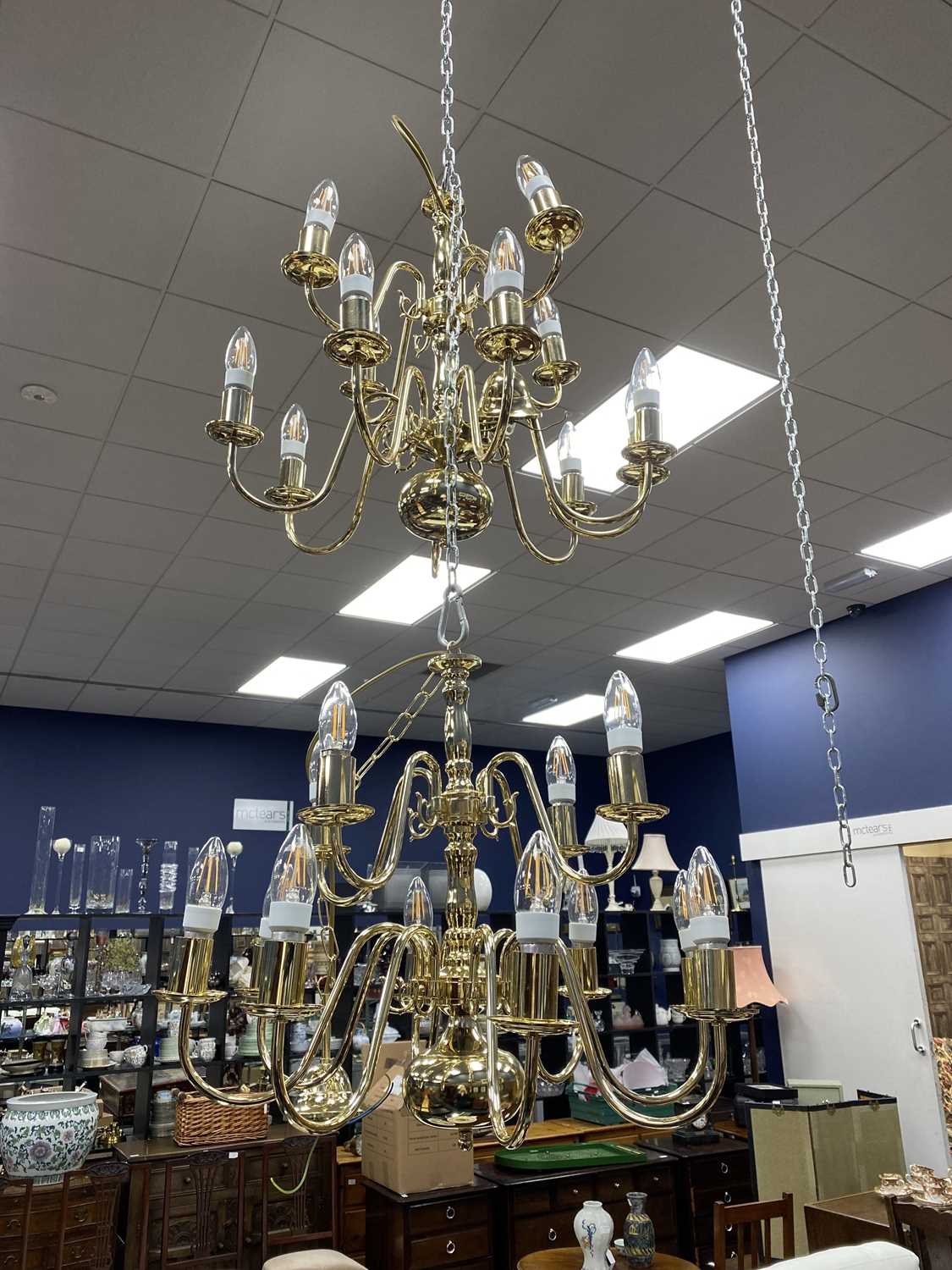 Lot 43 - A PAIR OF BRASS CHANDELIERS, ALONG WITH ANOTHER