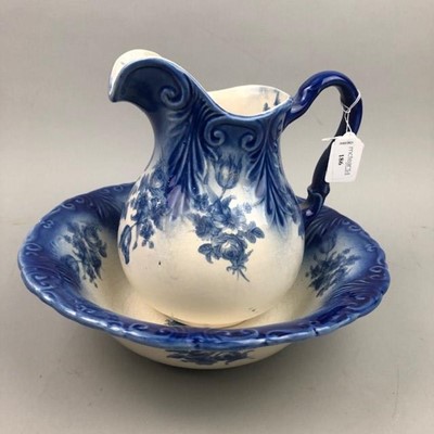 Lot 186 - A 20TH CENTURY BLUE AND WHITE STONEWARE EWER AND BASIN