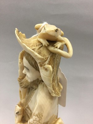 Lot 924 - A JAPANESE IVORY CARVING OF A MAN WITH FROGS