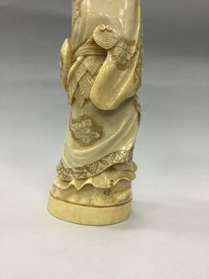 Lot 924 - A JAPANESE IVORY CARVING OF A MAN WITH FROGS