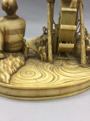Lot 926 - A JAPANESE IVORY CARVING OF FARMERS AND A WATER WHEEL
