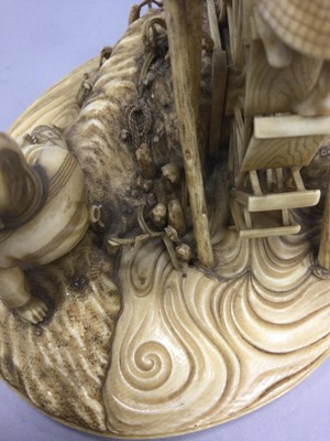 Lot 926 - A JAPANESE IVORY CARVING OF FARMERS AND A WATER WHEEL