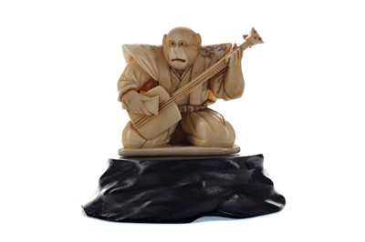 Lot 907 - A JAPANESE IVORY CARVING OF A MONKEY MUSICIAN