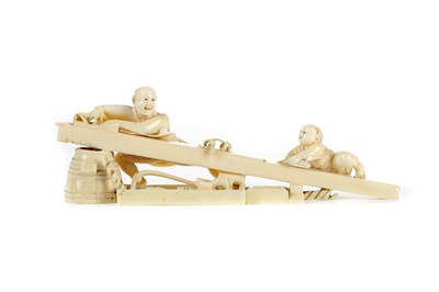 Lot 914 - A JAPANESE IVORY CARVING OF A CARPENTER