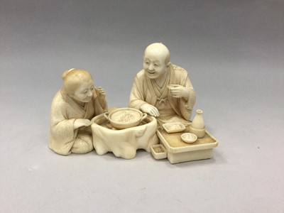 Lot 916 - A FINE JAPANESE IVORY CARVING OF A SEATED GROUP, WITH GOLD SEAL MARK