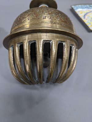 Lot 285 - AN EARLY 20TH CENTURY INDO-PERSIAN BRASS BELL, ALONG WITH A BUDDHIST EMBLEM AND TEN DISHES