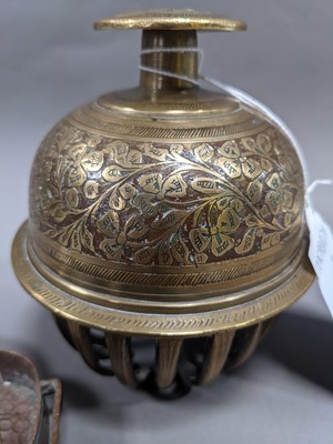 Lot 285 - AN EARLY 20TH CENTURY INDO-PERSIAN BRASS BELL, ALONG WITH A BUDDHIST EMBLEM AND TEN DISHES