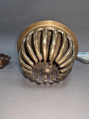 Lot 285 - AN EARLY 20TH CENTURY INDO-PERSIAN BRASS BELL, ALONG WITH A BUDDHIST EMBLEM AND TEN DISHES