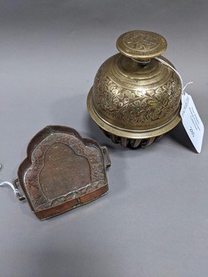Lot 285 - AN EARLY 20TH CENTURY INDO-PERSIAN BRASS BELL, ALONG WITH A BUDDHIST EMBLEM AND TEN DISHES