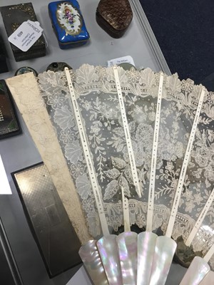 Lot 301 - A LATE VICTORIAN MOTHER OF PEARL AND LACE FAN