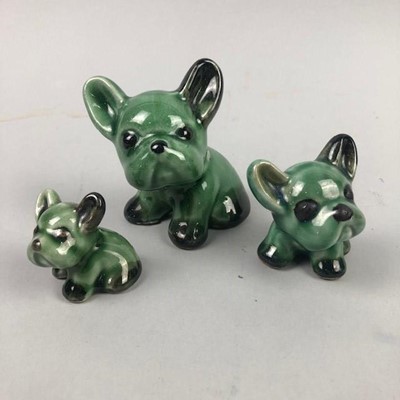 Lot 248 - A GRADUATED SET OF THREE DENBY GREEN GLAZED 'BYNGO' DOGS