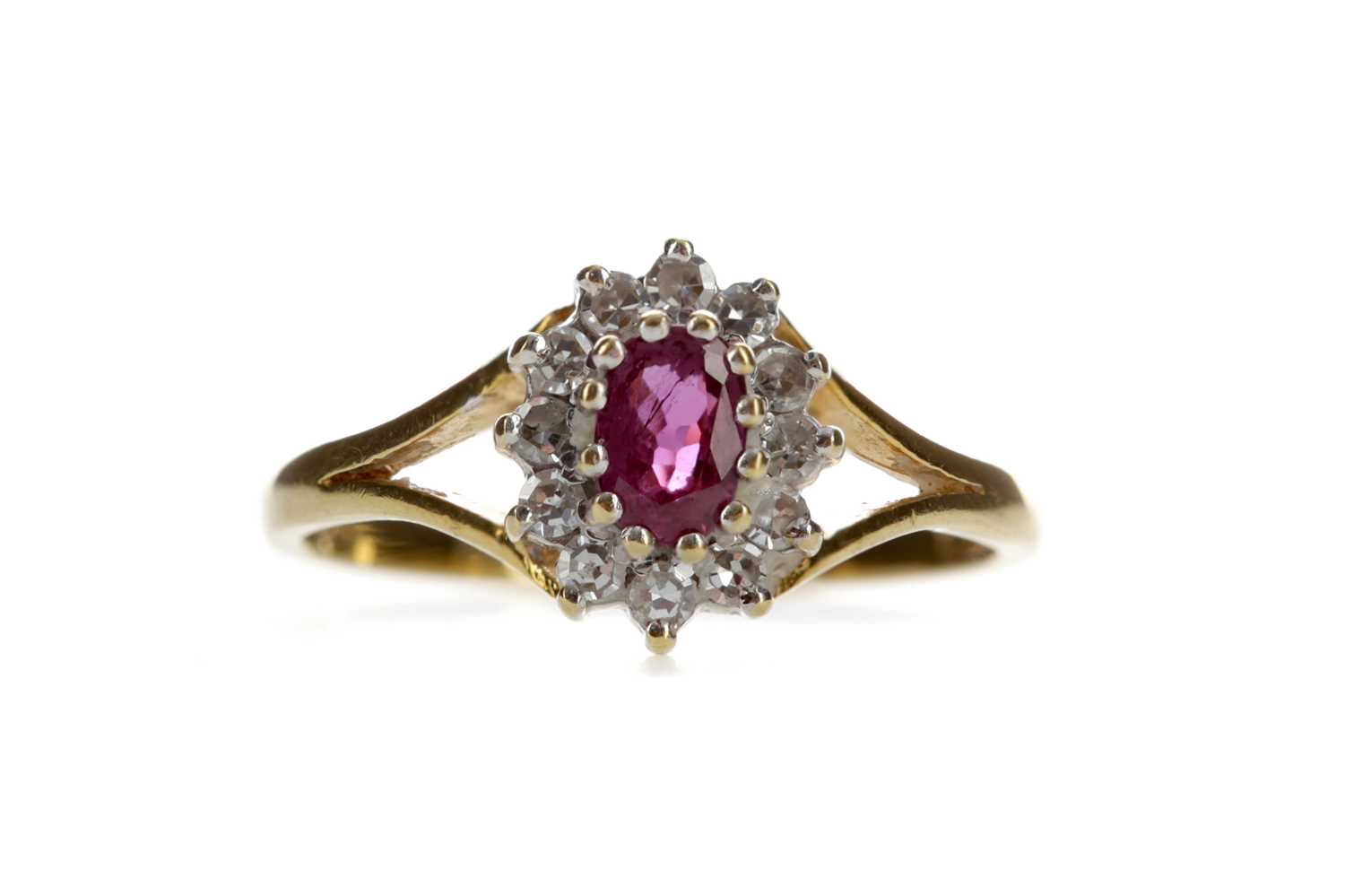 Lot 1310 - A RUBY AND DIAMOND CLUSTER RING
