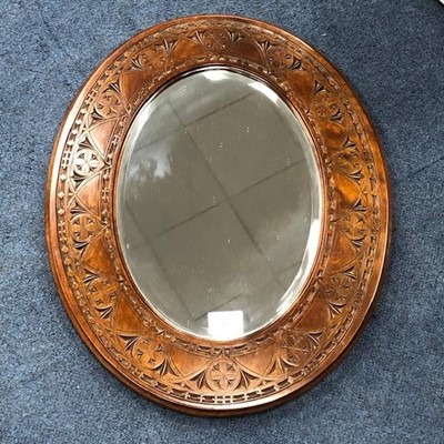 Lot 425 - A CARVED OVAL WALL MIRROR