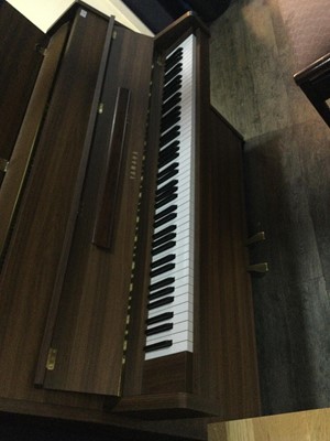 Lot 1110 - A YAMAHA UPRIGHT PIANO