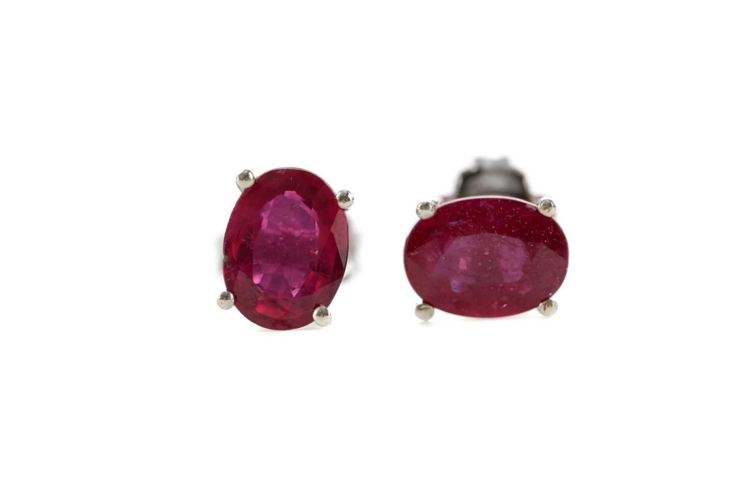Lot 1342 - A PAIR OF TREATED RUBY STUD EARRINGS