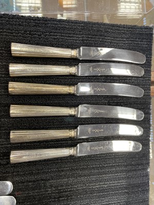 Lot 487 - A COMPOSITE SET OF TWELVE EARLY 19TH CENTURY SILVER HANDLED TABLE KNIVES, ALONG WITH SIX OTHERS