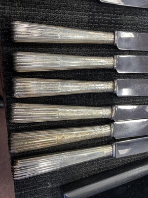 Lot 487 - A COMPOSITE SET OF TWELVE EARLY 19TH CENTURY SILVER HANDLED TABLE KNIVES, ALONG WITH SIX OTHERS
