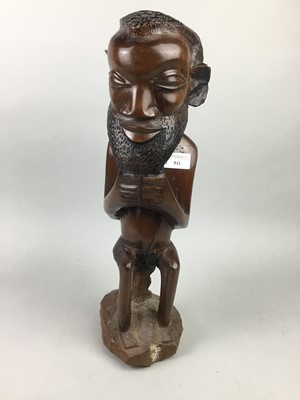 Lot 511 - AN AFRICAN HARDWOOD FIGURE OF A GENTLEMAN AND TWO OTHER CARVINGS