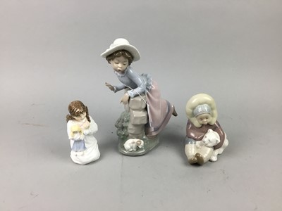 Lot 519 - A LLADRO FIGURE OF AN INUIT, A NAO FIGURE AND A ROYAL WORCESTER FIGURE