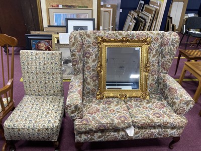 Lot 565 - A FLORAL UPHOLSTERED WING BACK SETTEE AND ANOTHER ARMCHAIR