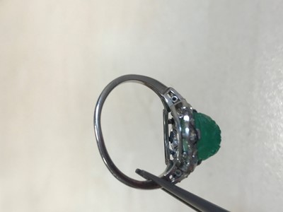Lot 1373 - CARVED EMERALD AND DIAMOND RING